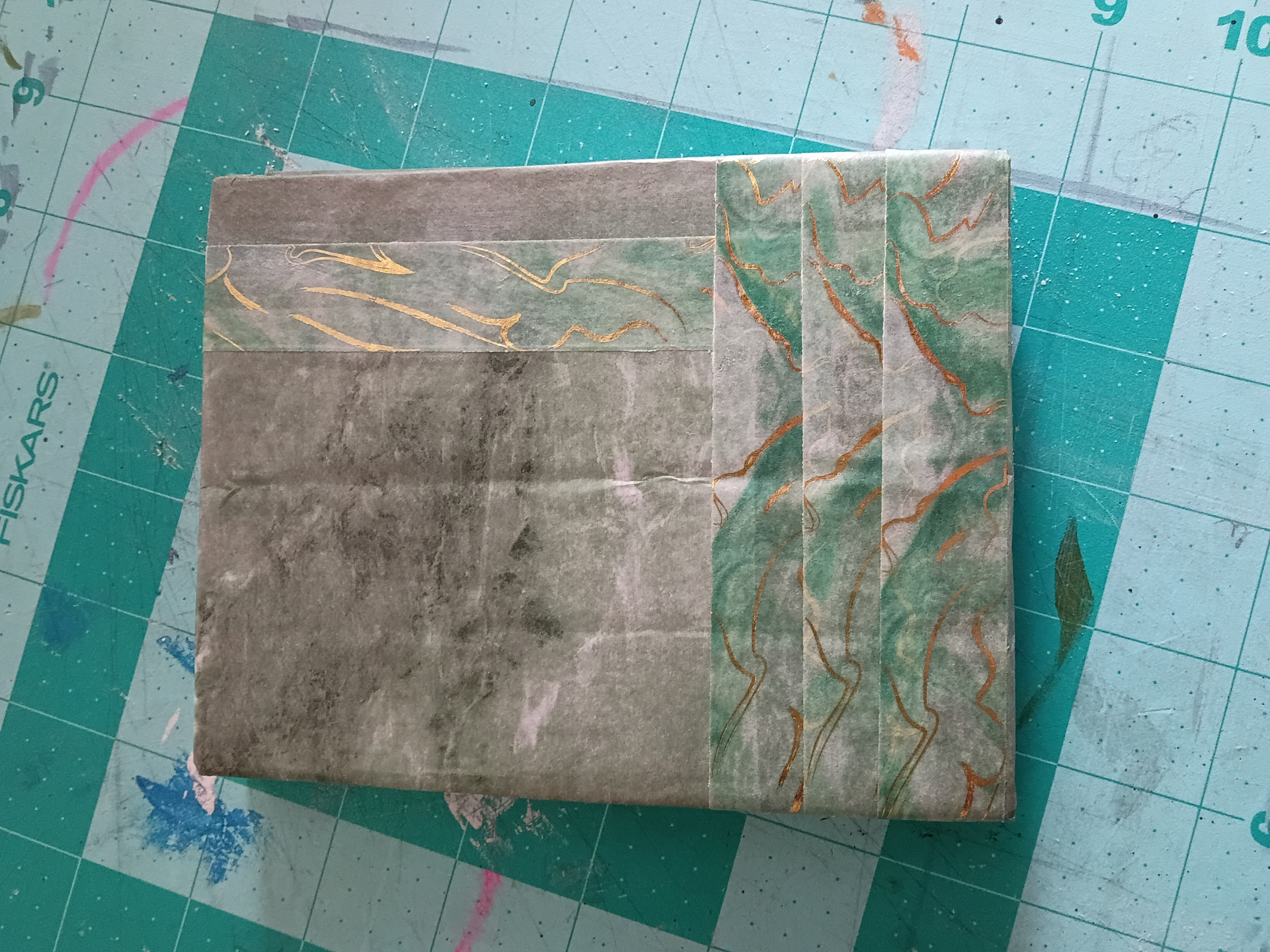 A book cover created with scrap paper and washi tape