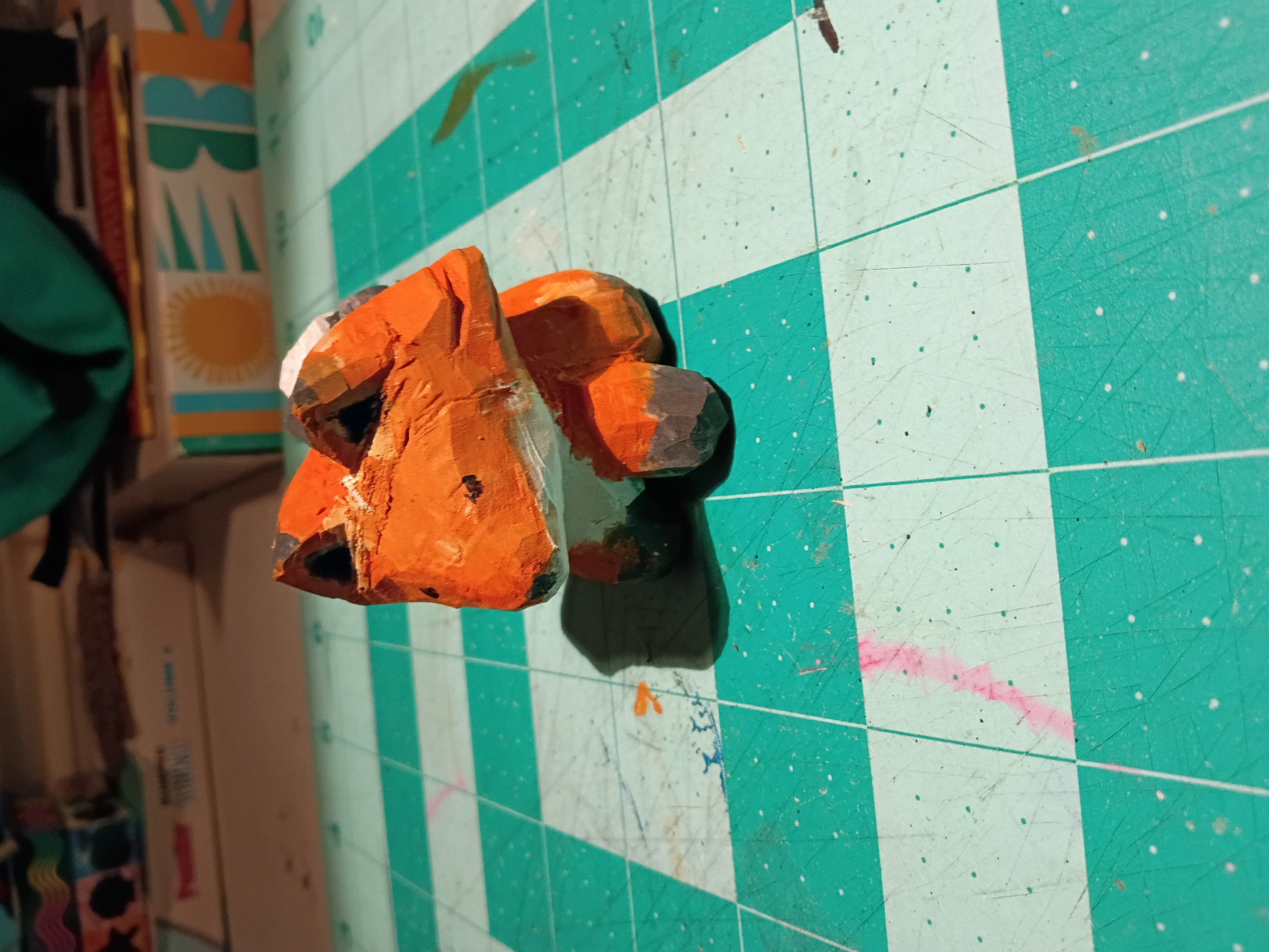 a small wooden fox sculpture